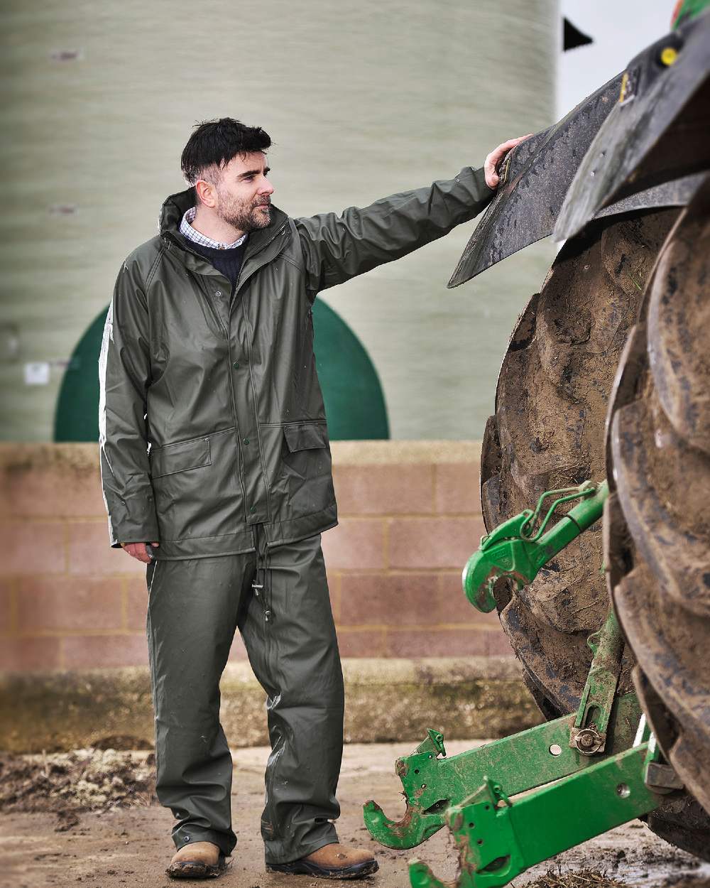 Olive coloured Fort Airflex Fortex Breathable Waterproof Jacket on blurry background 