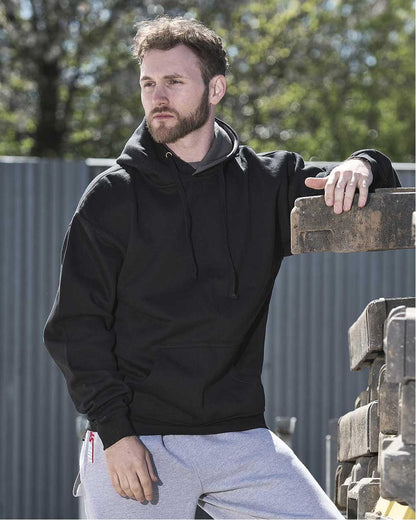 Black Coloured TuffStuff Hendon Hoodie On A Warehouse Background 